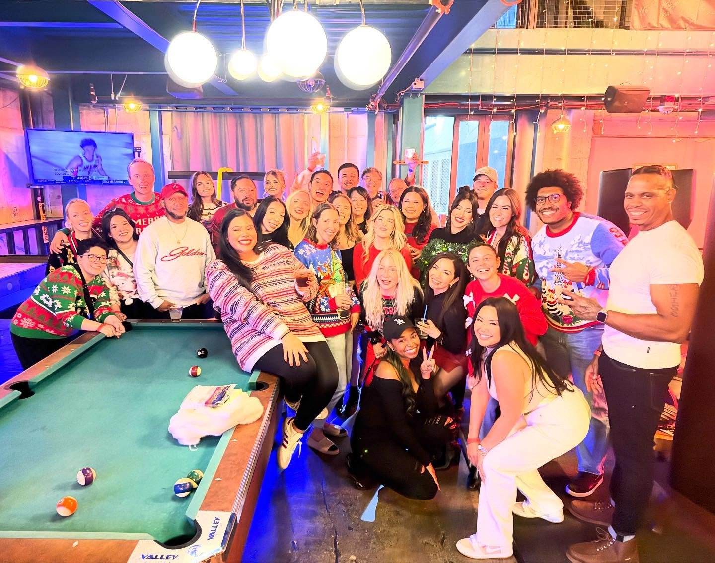 The Charlie Chen, M.D. team gathered together at a festive holiday party, smiling as a group