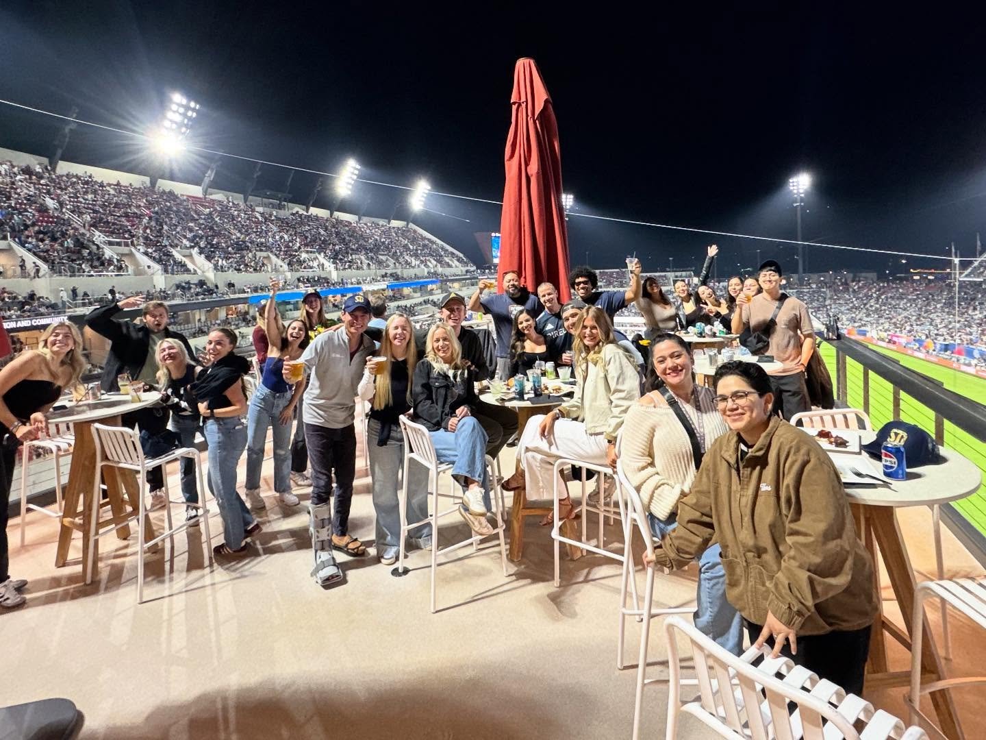 The practice team enjoying a night out together at a San Diego FC soccer match under stadium lights